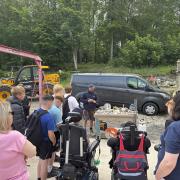 Adam Lees, Roxburghe Estates Senior Stonemason, demonstrates his trade to pupils from Kelso High School